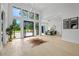 Bright foyer featuring soaring ceilings, modern chandelier, and oversized windows overlooking the front yard at 292 Highway 279, Fayetteville, GA 30214