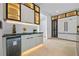 Modern kitchen with sleek cabinetry, built-in wine fridge, and black-framed glass display cases at 292 Highway 279, Fayetteville, GA 30214