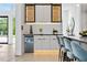 Modern kitchen with sleek cabinets, under-cabinet lighting, and a mini fridge at 292 Highway 279, Fayetteville, GA 30214
