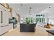 Modern kitchen with a center island, stainless steel appliances, and open view into the living room at 292 Highway 279, Fayetteville, GA 30214