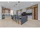 Bright, open kitchen featuring a large island with seating, sleek countertops, and modern lighting at 292 Highway 279, Fayetteville, GA 30214