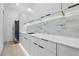 Modern kitchen featuring sleek cabinets and a white backsplash at 292 Highway 279, Fayetteville, GA 30214