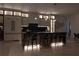 Kitchen with large island with seating and modern cabinetry with accent lighting at 292 Highway 279, Fayetteville, GA 30214