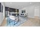 Open living room with modern decor, a sleek kitchen, and stylish furnishings at 292 Highway 279, Fayetteville, GA 30214