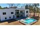 Rear exterior view of a modern home with a swimming pool and patio area at 292 Highway 279, Fayetteville, GA 30214