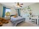bedroom with playful mural, large windows, and a ceiling fan at 976 Arthur Nw Ln, Atlanta, GA 30318