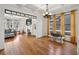 Open-concept dining area featuring coffered ceilings, hardwood floors, and large windows for abundant natural light at 976 Arthur Nw Ln, Atlanta, GA 30318