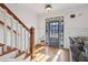 Inviting foyer with hardwood floors, staircase and charming front door entrance at 976 Arthur Nw Ln, Atlanta, GA 30318