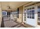 Inviting front porch with rocking chairs, ceiling fans, and ample natural light, perfect for relaxation and entertaining at 976 Arthur Nw Ln, Atlanta, GA 30318