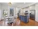 Bright kitchen with stainless steel appliances, center island, ample cabinet space, and adjacent dining area at 976 Arthur Nw Ln, Atlanta, GA 30318