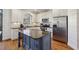Modern kitchen with stainless steel appliances, granite countertops, island, and ample storage space at 976 Arthur Nw Ln, Atlanta, GA 30318