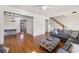 Open-concept living room with hardwood floors, wainscoting, and a comfortable sofa at 976 Arthur Nw Ln, Atlanta, GA 30318