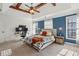 Large main bedroom with trey ceilings, ceiling fan, and two windows at 976 Arthur Nw Ln, Atlanta, GA 30318