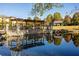 Community pond with pergola and reflections of the surrounding landscape at 976 Arthur Nw Ln, Atlanta, GA 30318