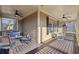 Spacious porch with seating area, ceiling fans, and lovely view at 976 Arthur Nw Ln, Atlanta, GA 30318