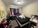 This bedroom has carpet, a window, and overhead lighting at 229 Odyssey Turn, Conyers, GA 30012