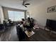 Bright living room featuring vinyl plank flooring and a large window for natural light at 229 Odyssey Turn, Conyers, GA 30012