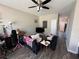 Cozy living room with ceiling fan, neutral walls and vinyl plank flooring throughout at 229 Odyssey Turn, Conyers, GA 30012