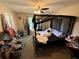 Bedroom featuring a canopy bed, ceiling fan, carpet, and natural light from the window at 229 Odyssey Turn, Conyers, GA 30012