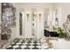 Elegant bathroom with marble accents, checkered tile floor, and gilded sconces at 3344 Peachtree Ne Rd # 3005, Atlanta, GA 30326