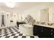 Luxurious bathroom with a soaking tub, marble accents, dual vanities, and black-and-white checkered floors at 3344 Peachtree Ne Rd # 3005, Atlanta, GA 30326