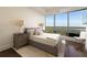 Cozy bedroom with large windows offering stunning city views and ambient natural light at 3344 Peachtree Ne Rd # 3005, Atlanta, GA 30326