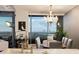 Dining area with city views, stylish chandelier, and contemporary furniture at 3344 Peachtree Ne Rd # 3005, Atlanta, GA 30326