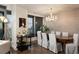Dining room featuring a modern chandelier, sleek furniture, and walls with subtle detailing at 3344 Peachtree Ne Rd # 3005, Atlanta, GA 30326