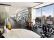 Bright gym featuring cardio machines, weight machines, cityscape views, and a refreshment station at 3344 Peachtree Ne Rd # 3005, Atlanta, GA 30326