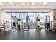Well-equipped gym with a range of machines and stunning cityscape views through floor-to-ceiling windows at 3344 Peachtree Ne Rd # 3005, Atlanta, GA 30326