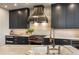 Modern kitchen with custom cabinetry, stainless steel appliances, a center island, and plenty of counter space at 3344 Peachtree Ne Rd # 3005, Atlanta, GA 30326