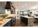 Modern kitchen with stainless steel appliances, island, and an open-concept design connecting the kitchen, living, and dining areas at 3344 Peachtree Ne Rd # 3005, Atlanta, GA 30326