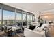 Bright, open living room with floor-to-ceiling windows and access to a large outdoor balcony with city views at 3344 Peachtree Ne Rd # 3005, Atlanta, GA 30326