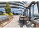 Outdoor dining area with grill and seating against the backdrop of a cityscape, creating an inviting space to relax at 3344 Peachtree Ne Rd # 3005, Atlanta, GA 30326