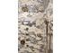 Close-up of a luxury shower with striking marble tile and modern bronze fixtures at 3344 Peachtree Ne Rd # 3005, Atlanta, GA 30326