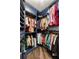 Organized walk-in closet with custom shelves and ample storage for clothes and accessories at 3344 Peachtree Ne Rd # 3005, Atlanta, GA 30326