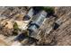 Aerial view of a house with mature trees and a large driveway, a shed and a two car garage at 5479 Dorsett Shoals Rd, Douglasville, GA 30135