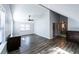 An airy bedroom featuring wood-look floors, natural light, a ceiling fan and light gray walls at 5479 Dorsett Shoals Rd, Douglasville, GA 30135