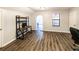 Bright bedroom with hardwood floors, a desk, natural light and a neutral color palette at 5479 Dorsett Shoals Rd, Douglasville, GA 30135