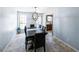 Dining room features a wooden table with seating for six and a view of the backyard at 5479 Dorsett Shoals Rd, Douglasville, GA 30135