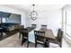 Dining area with wooden table and chairs, with a view into the adjacent living area at 5479 Dorsett Shoals Rd, Douglasville, GA 30135