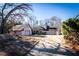 Charming home with a three car garage and mature trees on a sunny day at 5479 Dorsett Shoals Rd, Douglasville, GA 30135