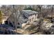 Spacious home featuring a deck, patio and a charming setting amidst mature trees at 5479 Dorsett Shoals Rd, Douglasville, GA 30135