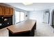 Open kitchen space with wood accents, an island, lots of space, and natural light at 5479 Dorsett Shoals Rd, Douglasville, GA 30135