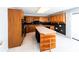 Classic kitchen with wood cabinets, a center island, and neutral countertops at 5479 Dorsett Shoals Rd, Douglasville, GA 30135