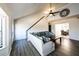 Bright living room with high ceilings, ceiling fan, hard flooring, and open view to dining area at 5479 Dorsett Shoals Rd, Douglasville, GA 30135