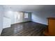 Open living room with wood-look floors, natural light and modern decor at 5479 Dorsett Shoals Rd, Douglasville, GA 30135