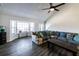 Inviting living room with vaulted ceilings, a sectional sofa, and a bay window with views at 5479 Dorsett Shoals Rd, Douglasville, GA 30135