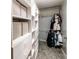 Organized walk-in closet with built-in shelving and ample space for storage at 5479 Dorsett Shoals Rd, Douglasville, GA 30135