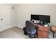 Bedroom featuring a carpeted floor, computer desk, and a white door to the left at 692 Oakside Pl, Acworth, GA 30102
